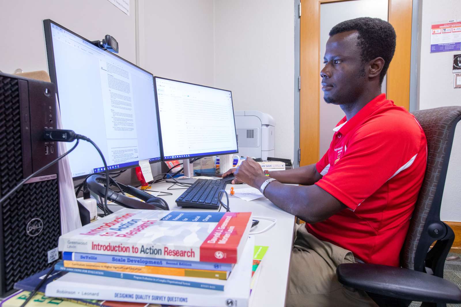 Man sitting at computer working on thesis